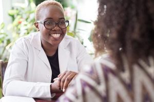a woman is happy to offer an intensive outpatient program