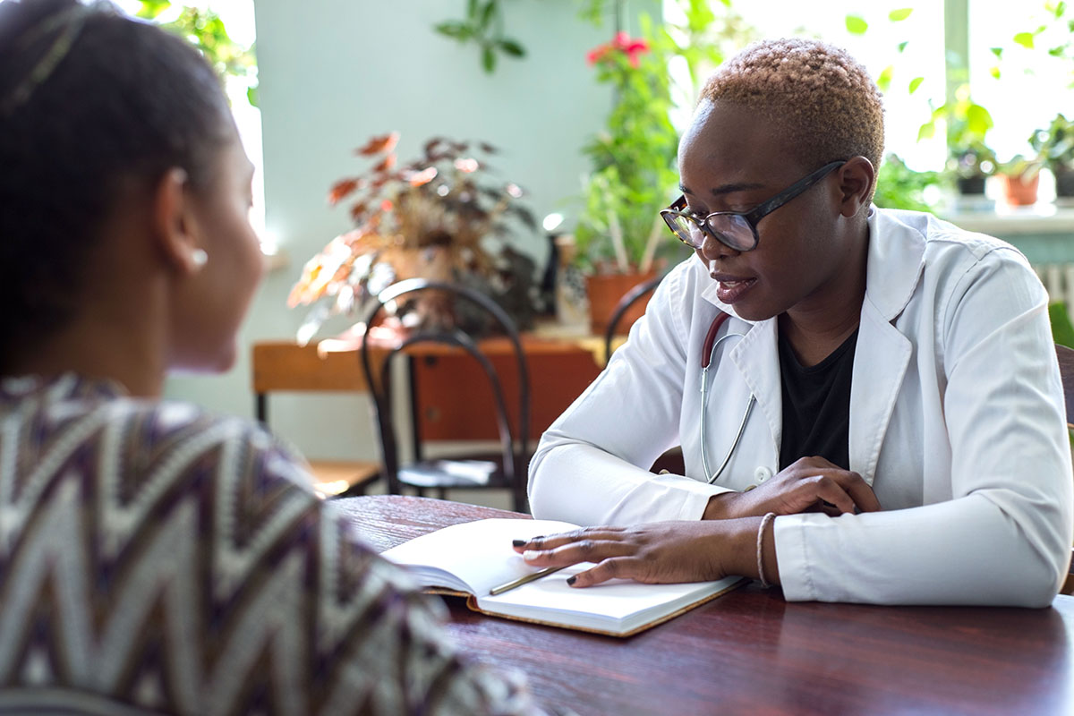 What Is MAT clinician and patient in naturally lit welcoming office discussing what is MAT
