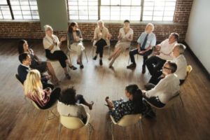 people sit in a circle at a group therapy program in jacksonville florida