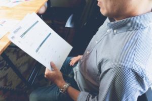 male looking at paperwork