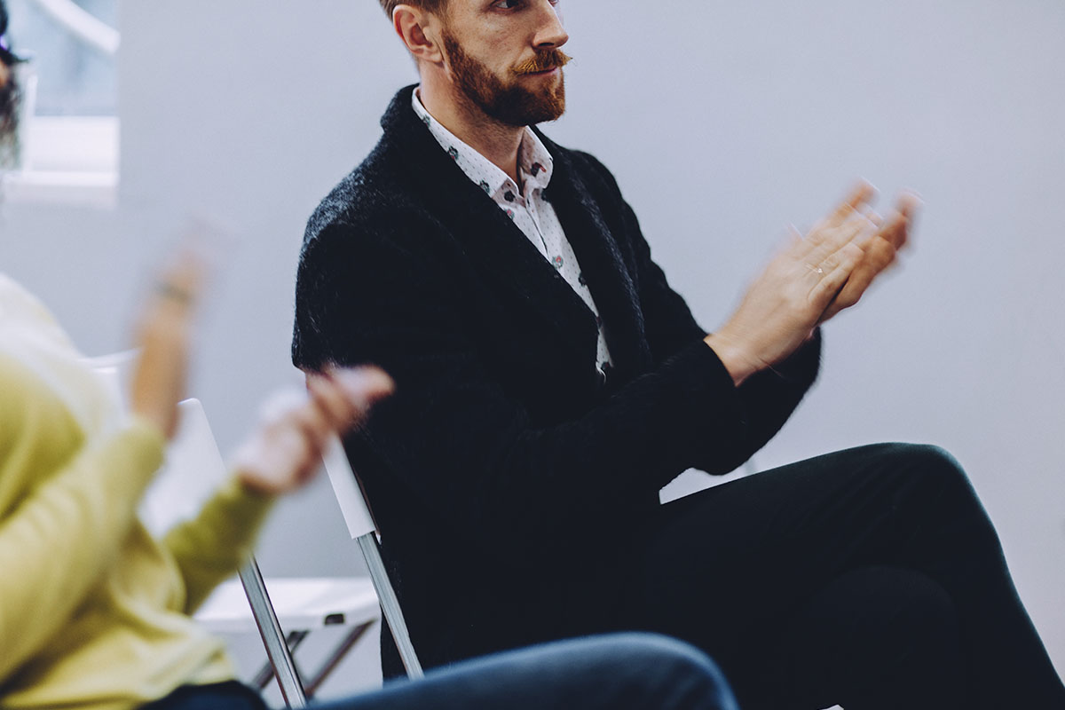 How to Prepare for an Evening IOP for Recovery (1) man sitting in group therapy in an evening IOP