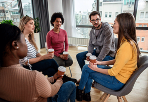 Group of diverse people in a meth rehab program participating in group therapy