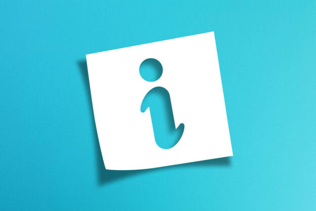 Note paper with information sign on blue background an i stands for information