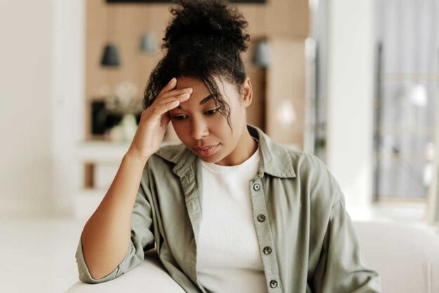 Do-I-Need-Intensive-Outpatient-Treatment-for-My-Alcohol-Addiction person with hand on forehead thinking about starting an IOP for alcohol