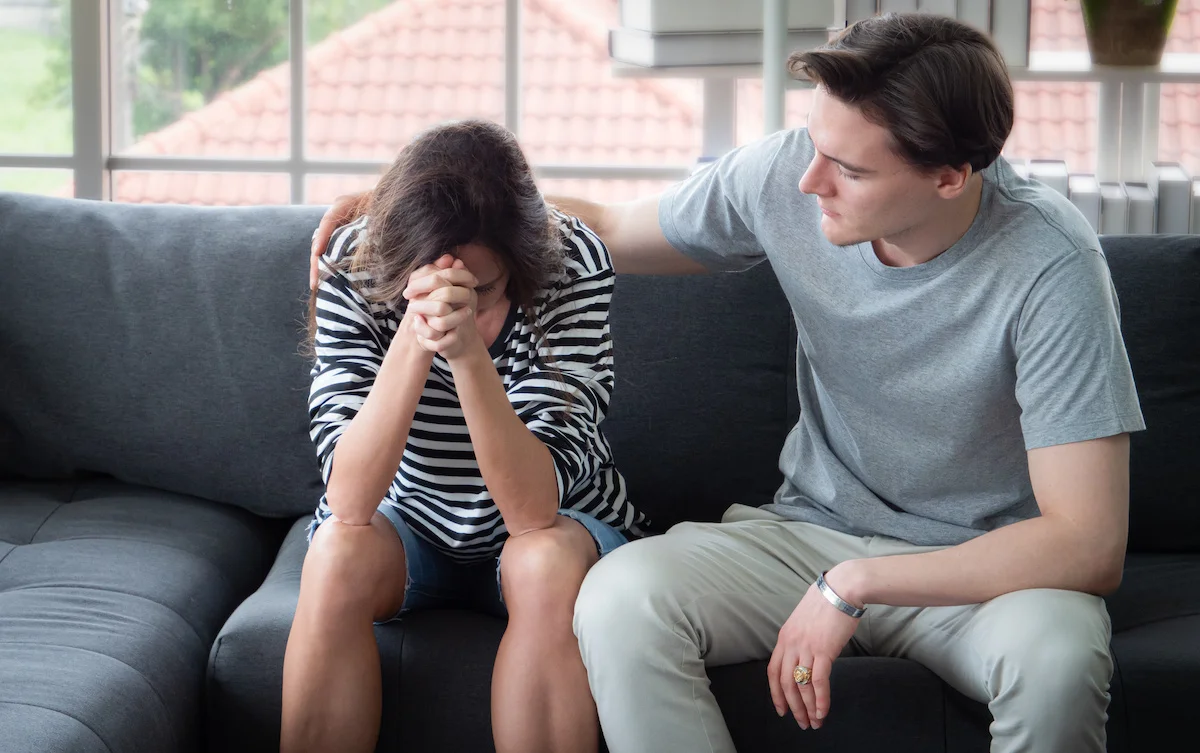 young man comforting loved one in their alcohol drinking issues