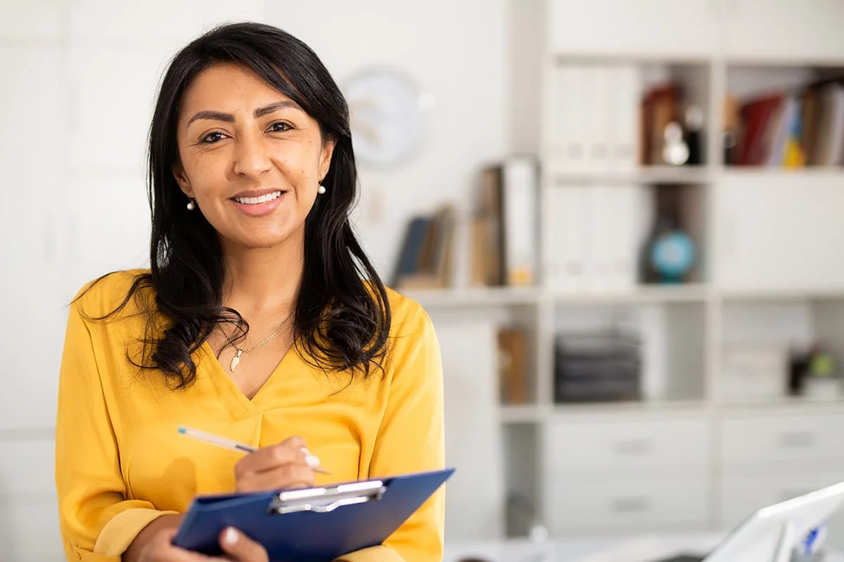 woman with clipboard practicing case management for addiction treatment with a client