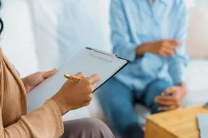 person in session with counselor learning answers to the question what is a partial hospitalization program